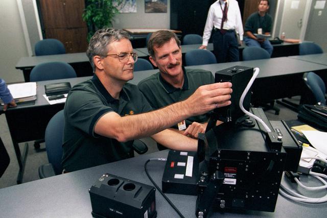 NASA image: Tanner and Garneau train on IMAX 3D motion picture camera