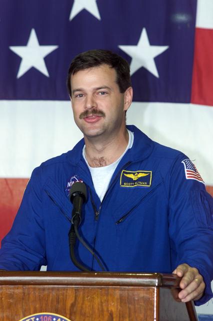 JSC2000-E-23453 (21 September 2000) --- Astronaut. Scott D. Altman, STS-106 pilot, addresses the crowd that visited Ellington Field's Hangar 990 to welcome home the STS-106 astronauts and cosmonauts.  The seven-man crew landed approximately 24 hours earlier in Florida, wrapping up a 4.9 million-mile mission in which more than three tons of equipment were delivered to the international outpost.