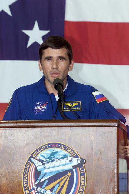 JSC2000-E-23459 (21 September 2000) --- Cosmonaut Yuri I. Malenchenko, STS-106 mission specialist representing the Russian Aviation and Space Agency, addresses the crowd that visited Ellington Field's Hangar 990 to welcome home the STS-106 astronauts and cosmonauts.  The seven-man crew landed approximately 24 hours earlier in Florida, wrapping up a 4.9 million-mile mission in which more than three tons of equipment were delivered to the international outpost.