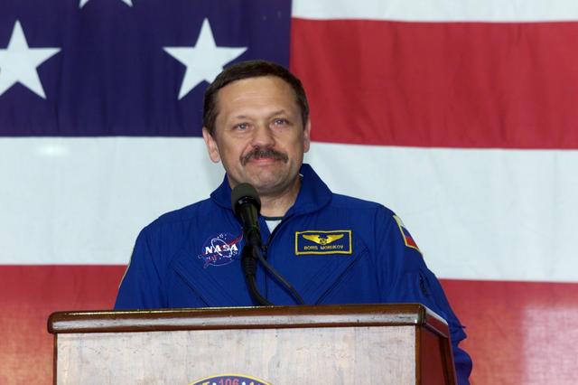 JSC2000-E-23460 (21 September 2000) ---  Cosmonaut Boris V. Morukov, STS-106 mission specialist representing the Russian Aviation and Space Agency,  addresses the crowd that visited Ellington Field's Hangar 990 to welcome home the STS-106 astronauts.  The seven-man crew landed approximately 24 hours earlier in Florida, wrapping up a 4.9 million-mile mission in which more than three tons of equipment were delivered to the international outpost.