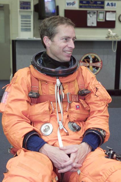 JSC2000-E-23713 (September 2000) --- Attired in a training version of his full-pressure launch and entry garment,  astronaut James D. Wetherbee, mission commander for STS-102, is pictured prior to participating in an emergency bailout training exercise in the Crew Compartment Trainer (CCT-2) of the Systems Integration Facility at the Johnson Space Center (JSC).