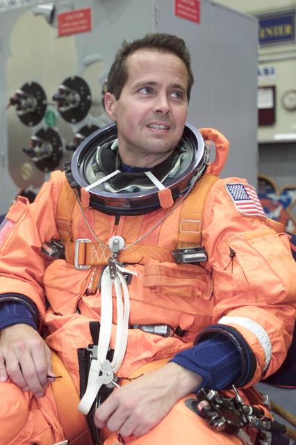 JSC2000-E-23715 (2 October 2000) --- Astronaut Daniel W. Bursch, Expedition Four flight engineer, relaxes following his suit-up process prior to a mission training session in the Space Vehicle Mockup Facility at the Johnson Space Center (JSC).
