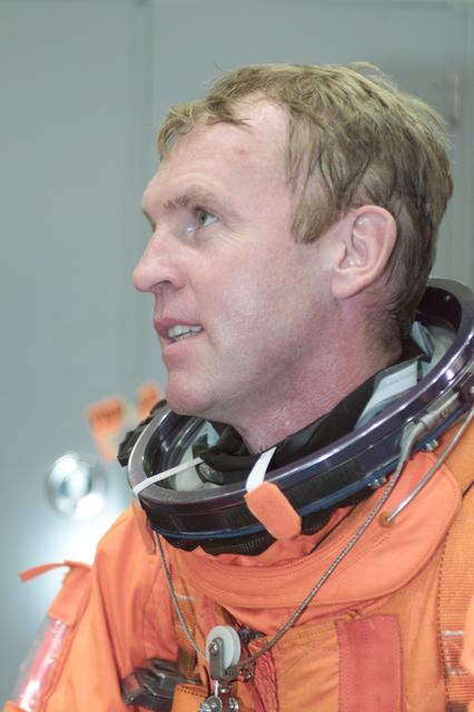 JSC2000-E-23717 (September 2000) --- Attired in a training version of his full-pressure launch and entry garment,  astronaut Andrew S.W. Thomas, mission specialist for STS-102, is pictured prior to participating in an emergency bailout training exercise in the Crew Compartment Trainer (CCT-2) of the Systems Integration Facility at the Johnson Space Center (JSC).