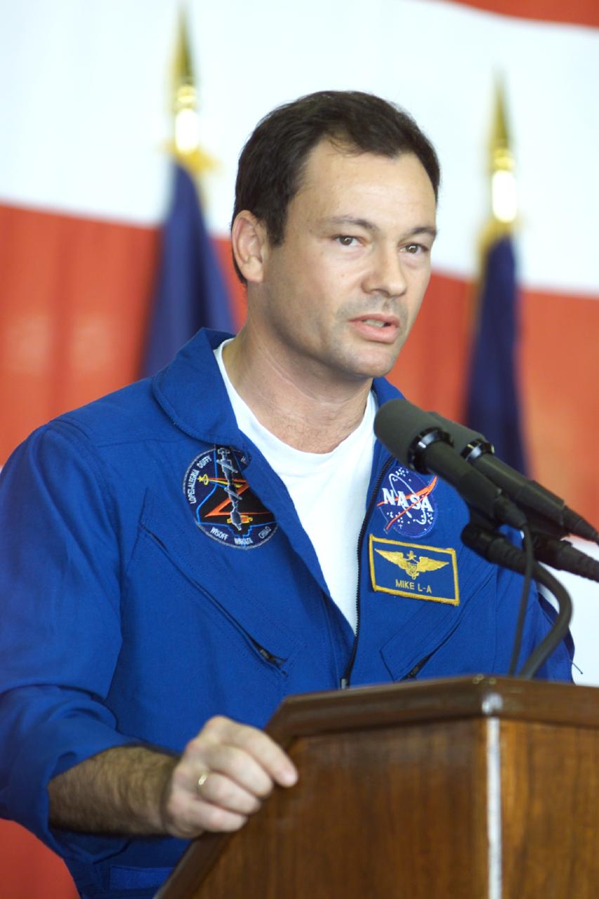JSC2000-E-27056 (27 October 2000) ---  Astronaut Michael Lopez-Alegria, mission specialist, addresses crowd at Ellington Field during crew return ceremonies.