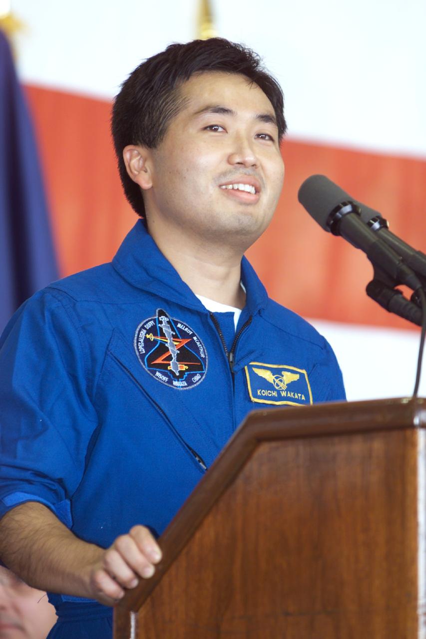 JSC2000-E-27058 (27 October 2000) ---  Astronaut Koichi Wakata, mission specialist, addresses crowd at Ellington Field during crew return ceremonies. Wakata represents Japan's National Space Development Agency (NASDA).