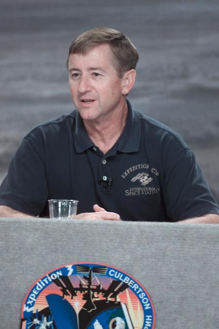 JSC2001-E-23191 (26 July 2001) --- Astronaut Frank L. Culbertson, Jr., Expedition Three mission commander, responds to a query during a pre-flight press conference at Johnson Space Center (JSC). The station crew members were later joined by the STS-105 crew on the dais. All seven men are to be launched into space aboard the Space Shuttle Discovery on August 9.