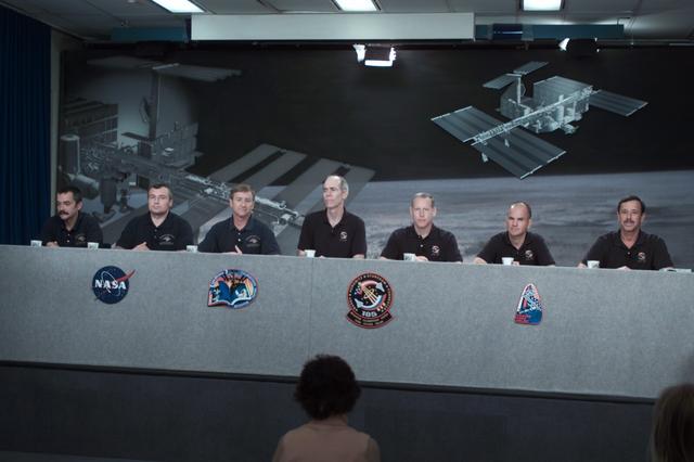 JSC2001-E-23198 (26 July 2001) --- Both the STS-105 and the Expedition Three crew members are photographed during a joint shuttle-station pre-flight press conference at Johnson Space Center (JSC). From the left are cosmonauts Mikhail Tyurin and Vladimir N. Dezhurov, both Expedition Three flight engineers, astronaut Frank L. Culbertson, Jr., Expedition Three mission commander; Daniel T. Barry and Patrick G. Forrester, both STS-105 mission specialists; along with Frederick W. Sturckow and Scott J. Horowitz, pilot and mission commander, respectively. Tyurin and Dezhurov represent Rosaviakosmos.