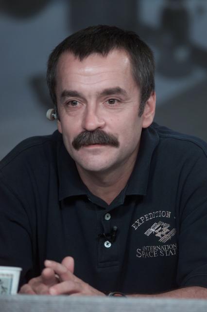 JSC2001-E-23202 (26 July 2001) --- Cosmonaut Mikhail Tyurin, Expedition Three flight engineer representing Rosaviakosmos, listens to a question from a news media representative during a joint shuttle-station pre-flight press conference at Johnson Space Center (JSC).