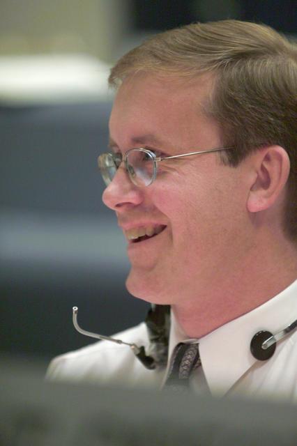 JSC2001-E-24994 (10 August 2001) --- Flight director John Shannon finds a moment of levity while working at his console in the shuttle flight control room (WFCR) in Houston's Mission Control Center (MCC). Several hundred miles away in Florida, the STS-105 and Expedition Three crew members were awaiting countdown in the crew cabin of the Space Shuttle Discovery on the launch pad at the Kennedy Space Center (KSC). As soon as the vehicle cleared the tower in Florida, the Houston-based team of flight controllers took over the ground control of the flight.