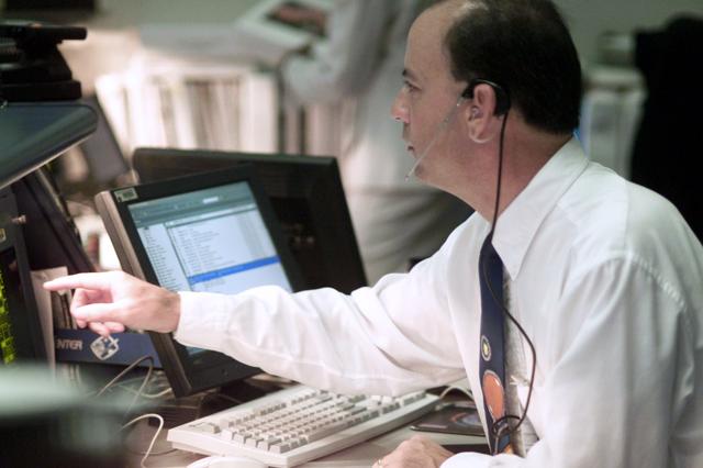 JSC2001-E-25106 (16 August 2001) --- ISS flight director Mark Ferring monitors data at his console in the station flight control room (BFCR) in Houston&#0146;s Mission Control Center (MCC) during the first of two scheduled space walks on Discovery&#0146;s voyage to the International Space Station (ISS).