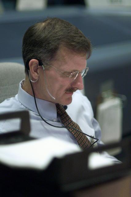 JSC2001-E-25121 (16 August 2001) --- Astronaut Joseph R. Tanner, STS-105 spacecraft communicator (CAPCOM), monitors the progress of the extravehicular activity at his console in the shuttle flight control room (WFCR) in Houston’s Mission Control Center (MCC). At the time this photo was taken, mission specialists Daniel T. Barry and Patrick G. Forrester were performing the first of two scheduled space walks to perform work on the International Space Station (ISS).