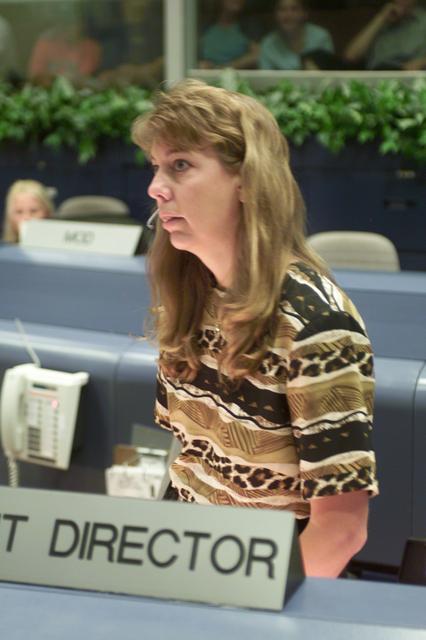 JSC2001-E-25399 (17 August 2001) --- Flight director Kelly Beck monitors data at her console in the shuttle flight control room (WFCR) in Houston&#0146;s Mission Control Center (MCC).