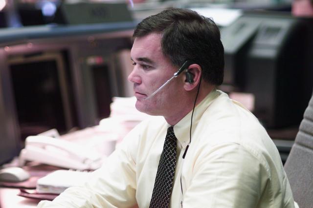 JSC2001-E-25466 (16 August 2001) --- Flight director Bryan Austin studies data at his console in the shuttle flight control room (WFCR) in Houston's Mission Control Center (MCC) during the STS-105 mission.