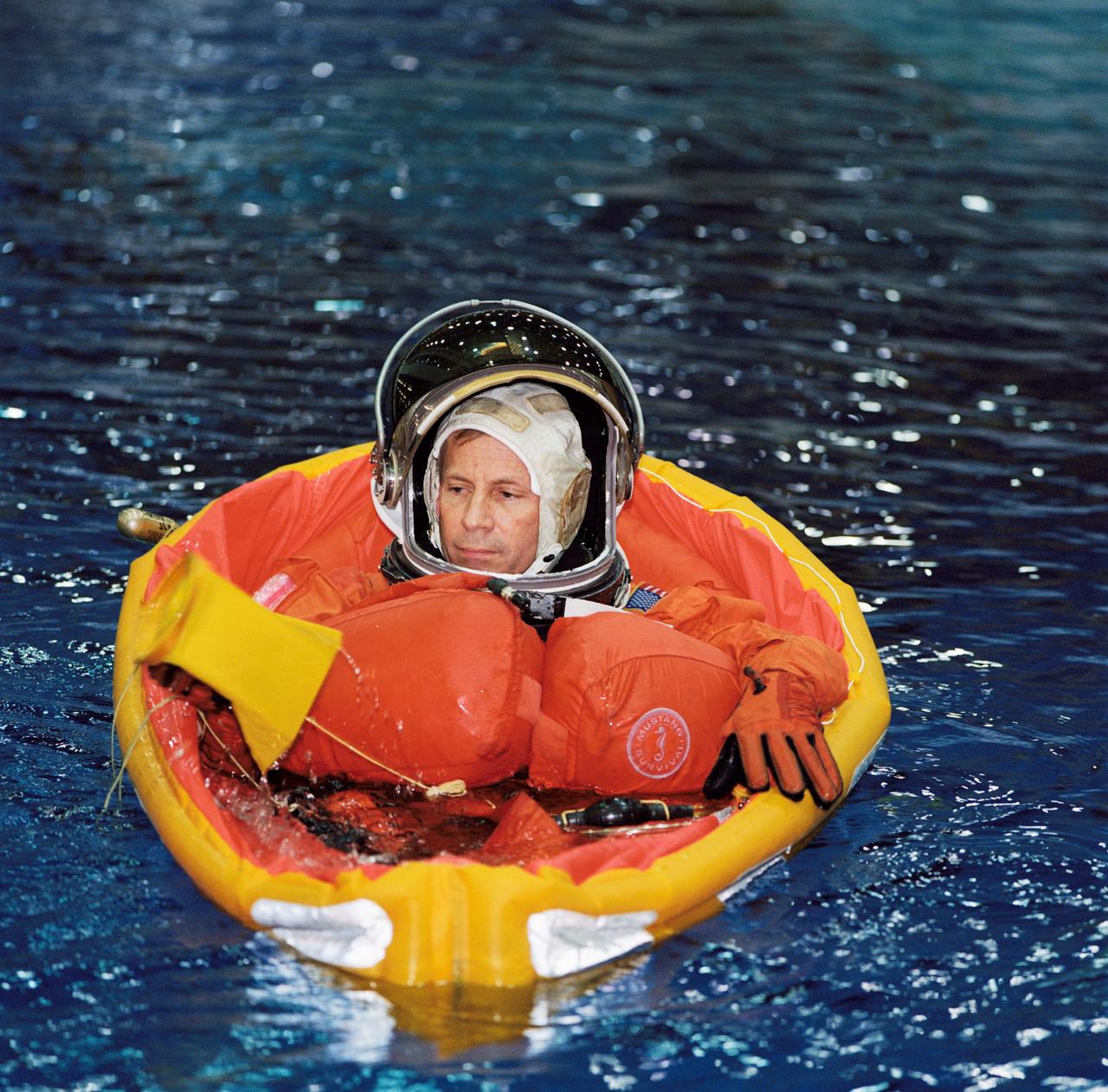 JSC2002-00413 (4 February 2002) --- Astronaut Kenneth D. Cockrell, STS-111 mission commander, floats in a small life raft during an emergency bailout training session in the Neutral Buoyancy Laboratory (NBL) near the Johnson Space Center (JSC). STS-111 will be the 14th shuttle mission to visit the International Space Station (ISS).