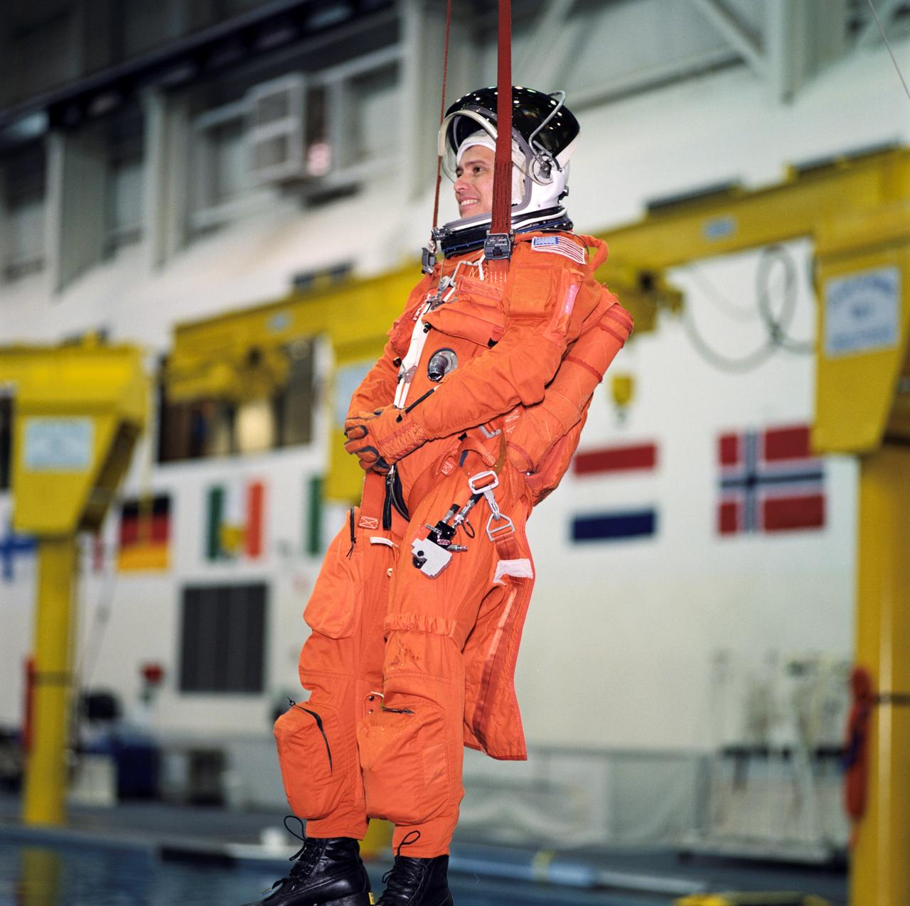 JSC2002-00417 (4 February 2002) --- Astronaut Franklin R. Chang-Diaz, STS-111 mission specialist, simulates a parachute drop into water during an emergency bailout training session at the Neutral Buoyancy Laboratory (NBL) near the Johnson Space Center (JSC). Chang-Diaz is attired in a training version of the shuttle launch and entry garment. STS-111 will be the 14th shuttle mission to visit the International Space Station (ISS).