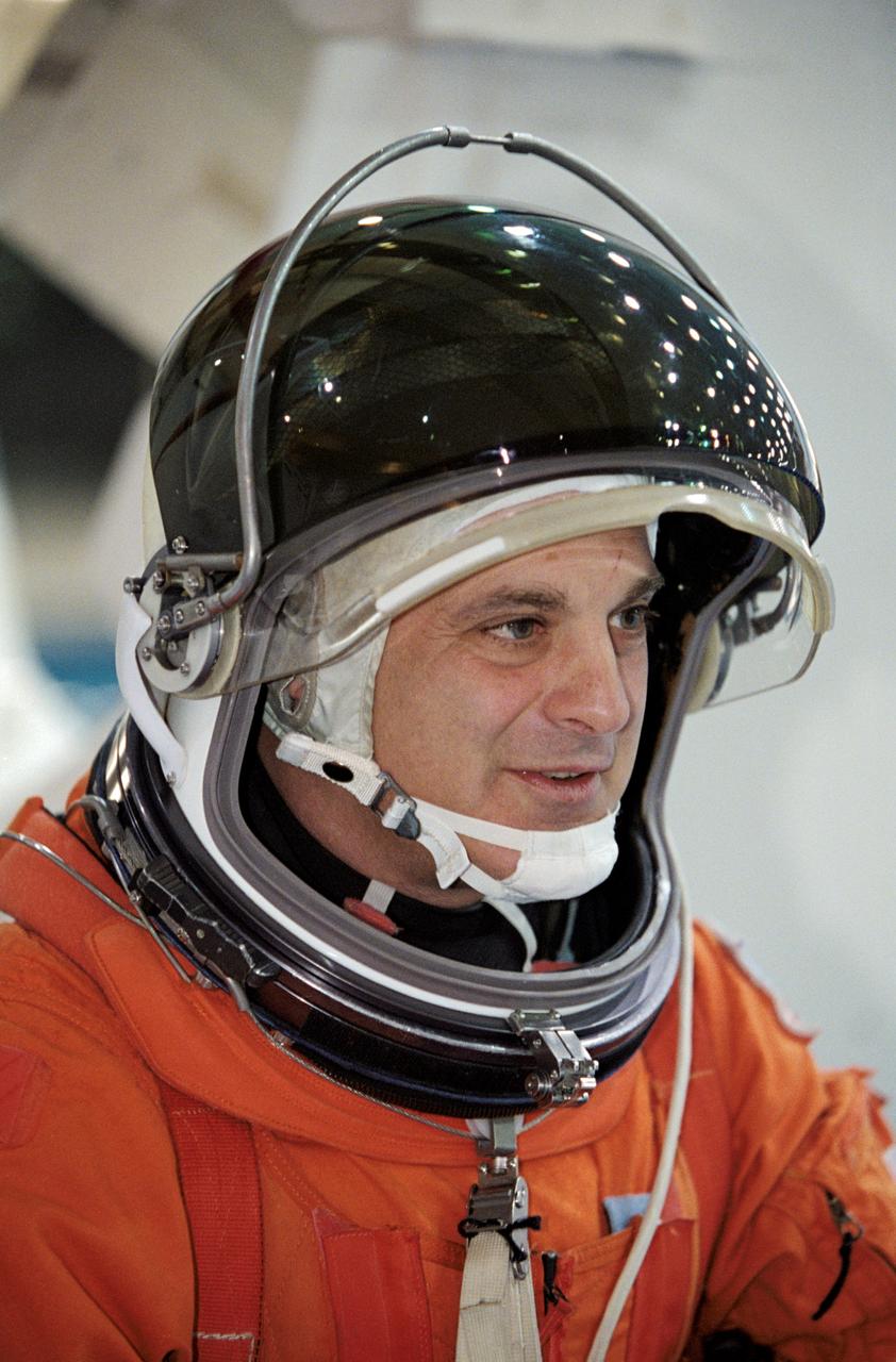 JSC2002-00522 (19 February 2002) --- Astronaut David A. Wolf, STS-112 mission specialist, attired in a training version of the shuttle launch and entry suit, awaits the start of a mission training session at the Neutral Buoyancy Laboratory (NBL) near the Johnson Space Center (JSC).