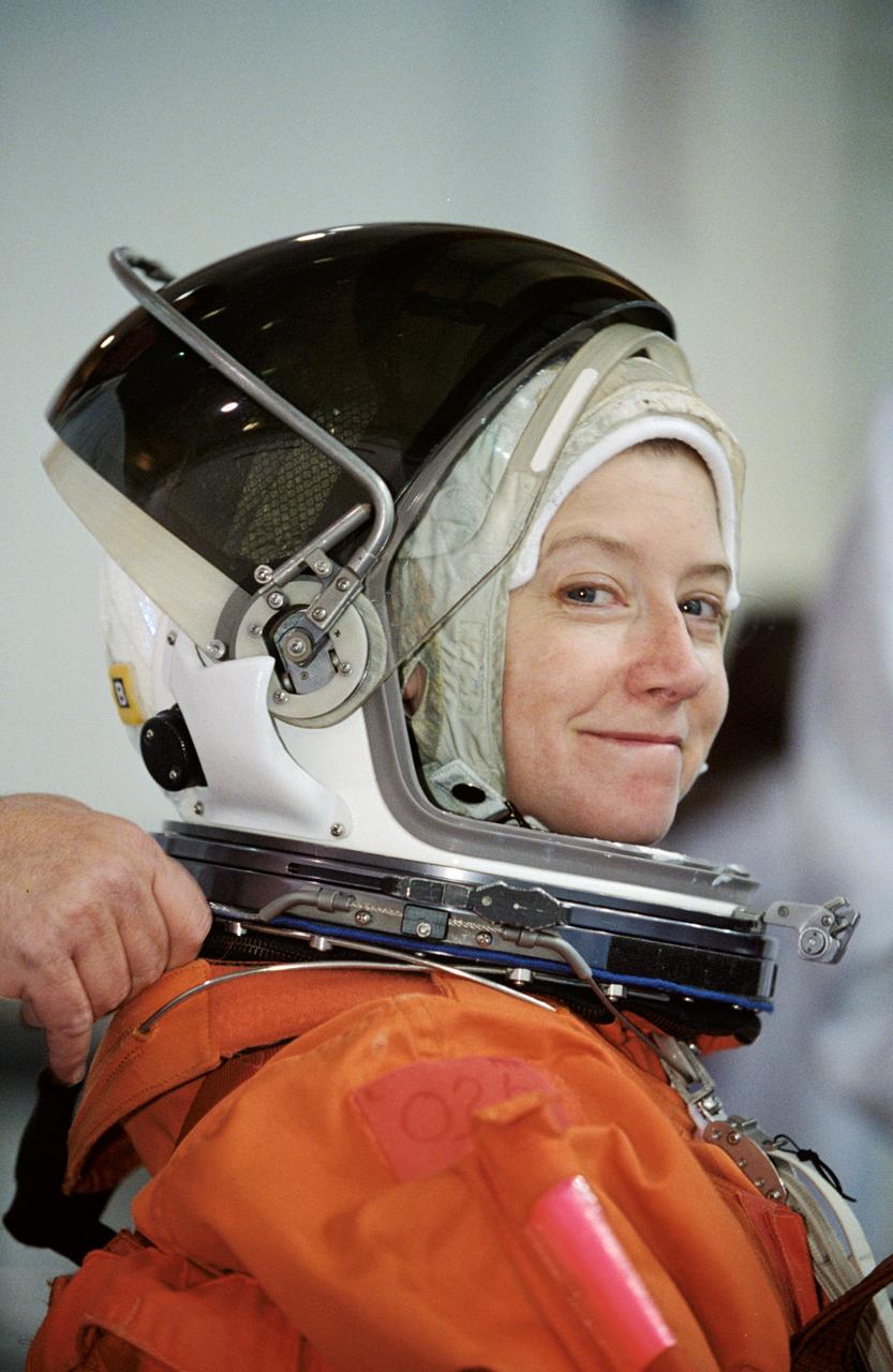 JSC2002-00528 (19 February 2002) --- Astronaut Pamela A. Melroy, STS-112 pilot, attired in a training version of the shuttle launch and entry suit, awaits the start of a mission training session at the Neutral Buoyancy Laboratory (NBL) near the Johnson Space Center (JSC).