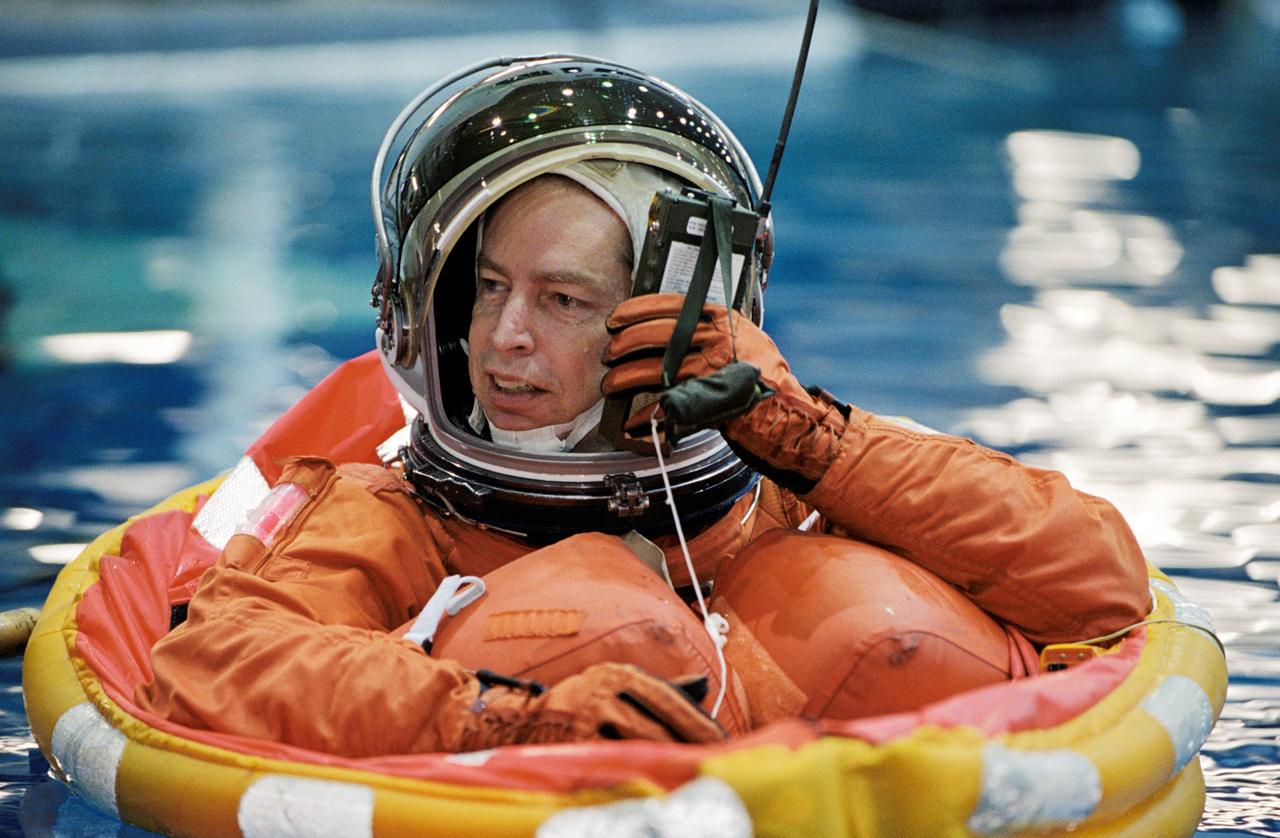 JSC2002-00529 (19 February 2002) --- Astronaut James D. Wetherbee, STS-113 mission commander, floats in a small life raft during an emergency bailout training session in the Neutral Buoyancy Laboratory (NBL) near the Johnson Space Center (JSC).