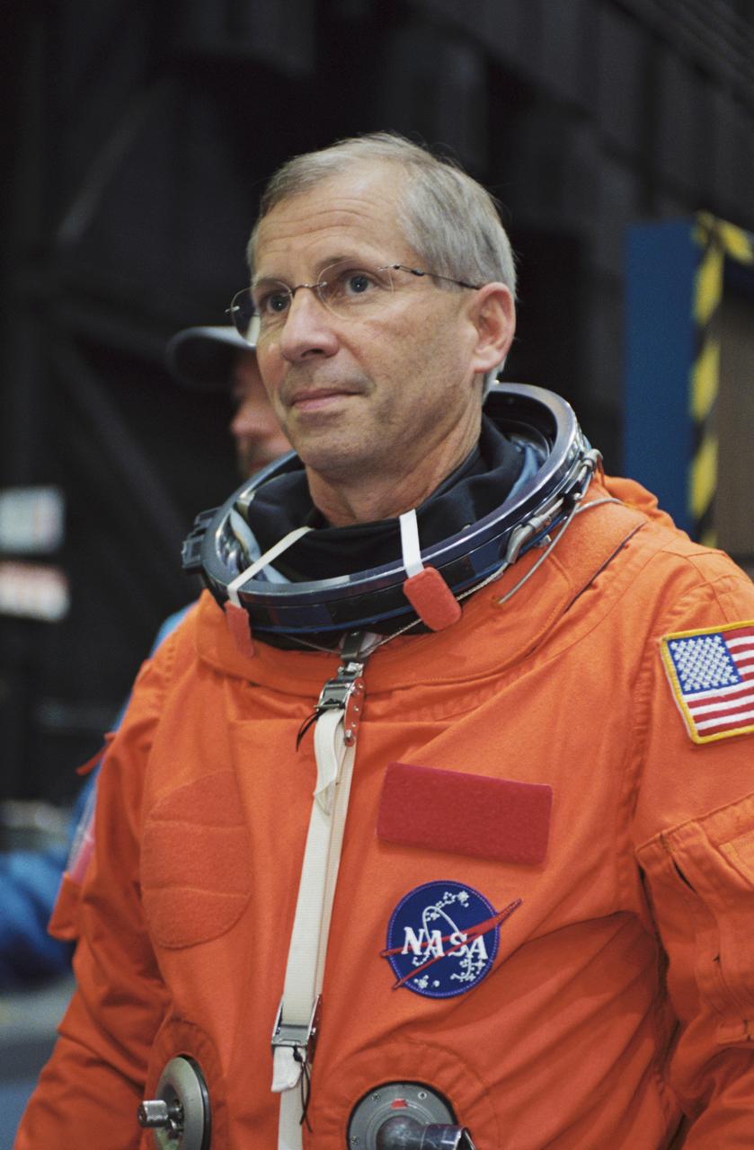 JSC2002-00725 (29 March 2002) --- Astronaut Kenneth D. Cockrell, STS-111 mission commander, attired in a training version of the shuttle launch and entry suit, awaits a mission training session in the Space Vehicle Mockup Facility at Johnson Space Center (JSC).