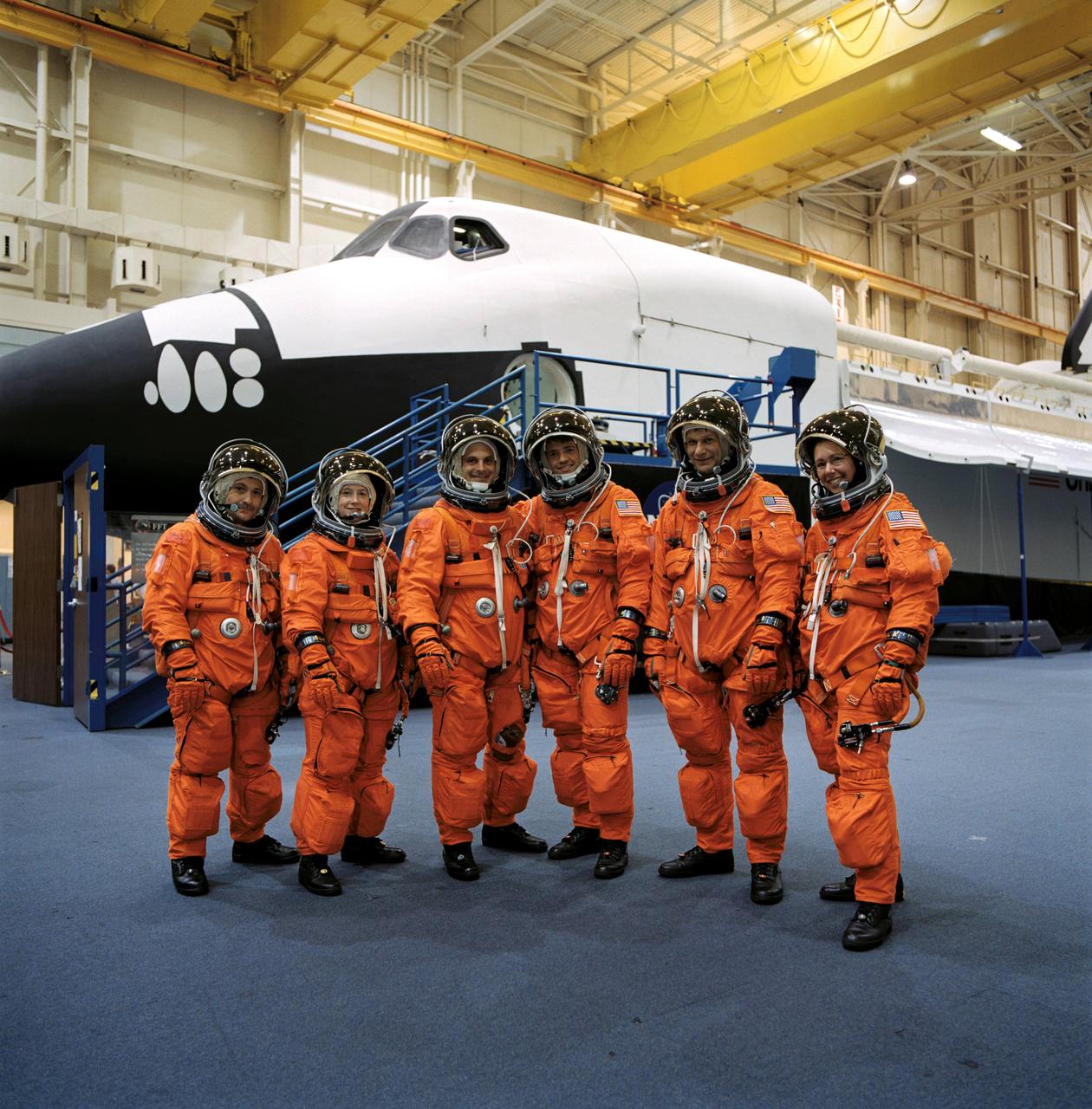 JSC2002-00882 (24 April 2002) --- The STS-112 crewmembers, attired in training versions of the full-pressure launch and entry suit, pose for a crew photo prior to a training session in the Space Vehicle Mockup Facility at the Johnson Space Center (JSC). From the left are cosmonaut Fyodor N. Yurchikhin, mission specialist; astronauts Pamela A. Melroy, pilot; David A. Wolf, mission specialist; Jeffrey S. Ashby, mission commander; Piers J. Sellers and Sandra H. Magnus, both mission specialists. Yurchikhin represents Rosaviakosmos.