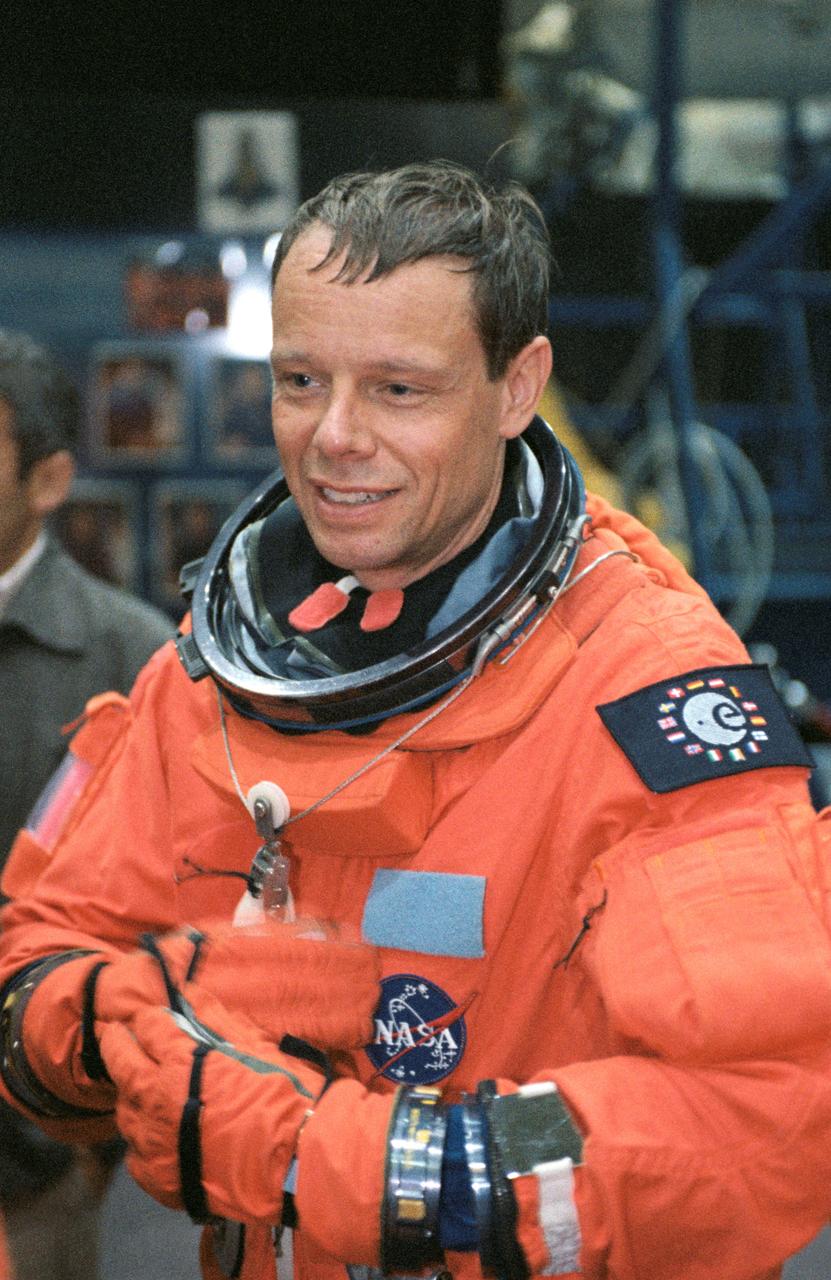 JSC2002-01539 (8 August 2002) --- Astronaut Christer Fuglesang, STS-116 mission specialist, dons his training version of the full-pressure launch and entry suit prior to a training session in the Space Vehicle Mockup Facility at the Johnson Space Center (JSC). Fuglesang represents the European Space Agency (ESA).