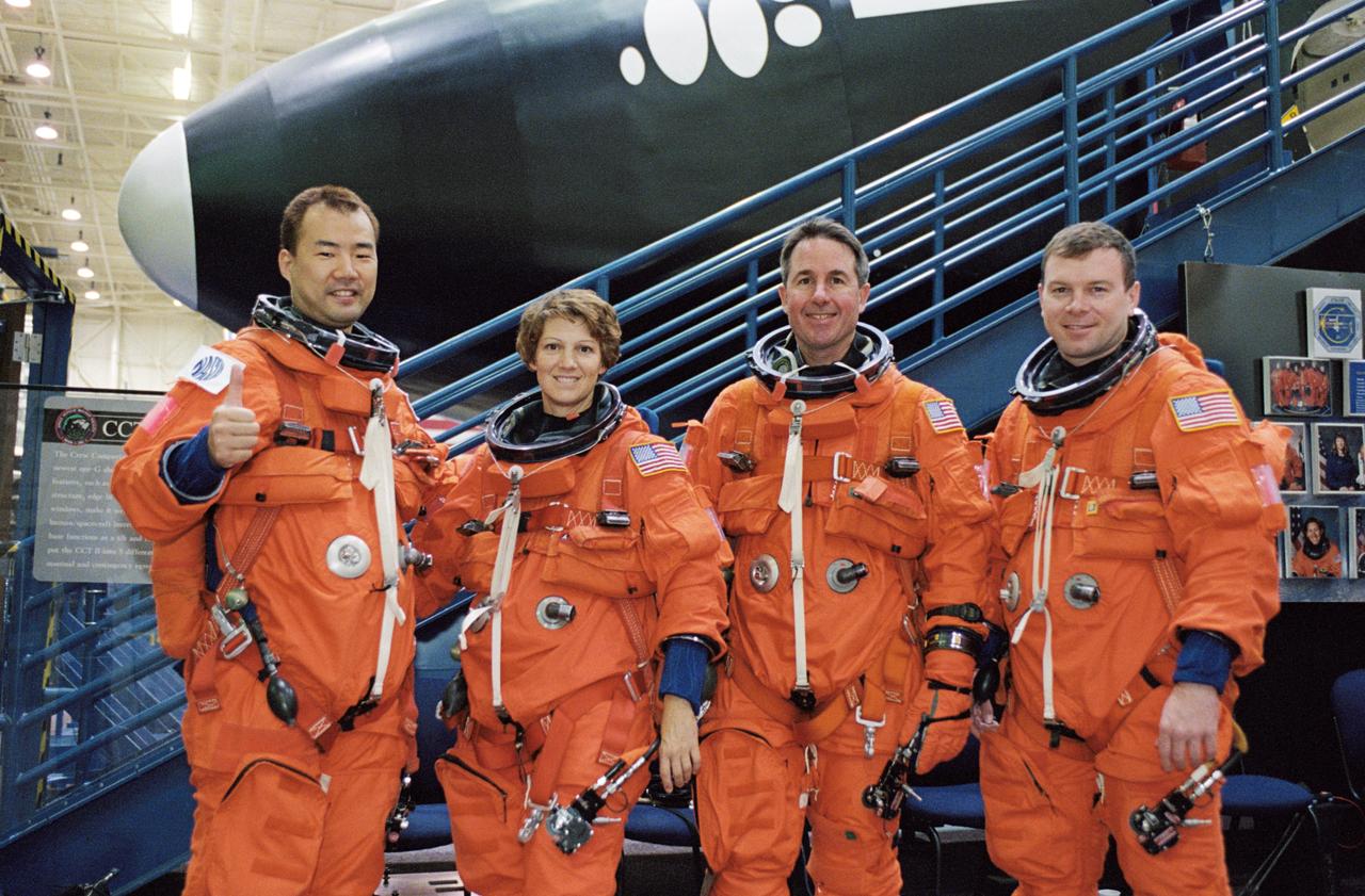 JSC2002-01659 (12 September 2002) --- The STS-114 crewmembers pose for a group photo prior to a training session in the Space Vehicle Mockup Facility at the Johnson Space Center (JSC). From the left are astronauts Soichi Noguchi, mission specialist; Eileen M. Collins, mission commander; Stephen K. Robinson, mission specialist; and James M. Kelly, pilot. Noguchi represents Japan&#0146;s National Space Development Agency (NASDA).