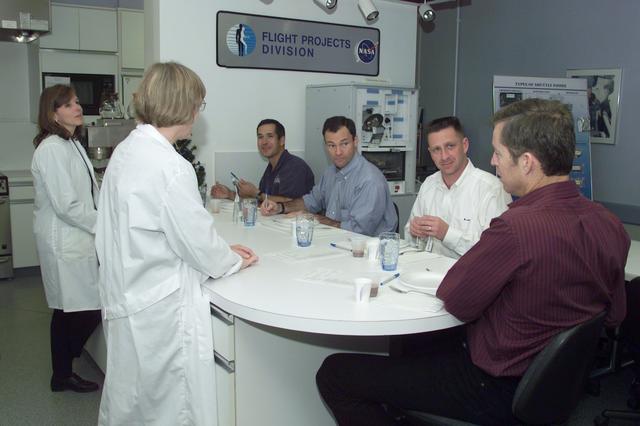 JSC2002-E-01668 (9 January 2002) --- The STS-113 crewmembers are briefed by dietitians during food tasting in the Flight Projects Division Laboratory at the Johnson Space Center (JSC). From front to back are astronauts James D. Wetherbee and Christopher J. (Gus) Loria, mission commander and pilot, respectively, and Michael E. Lopez-Alegria and John B. Herrington, both mission specialists.