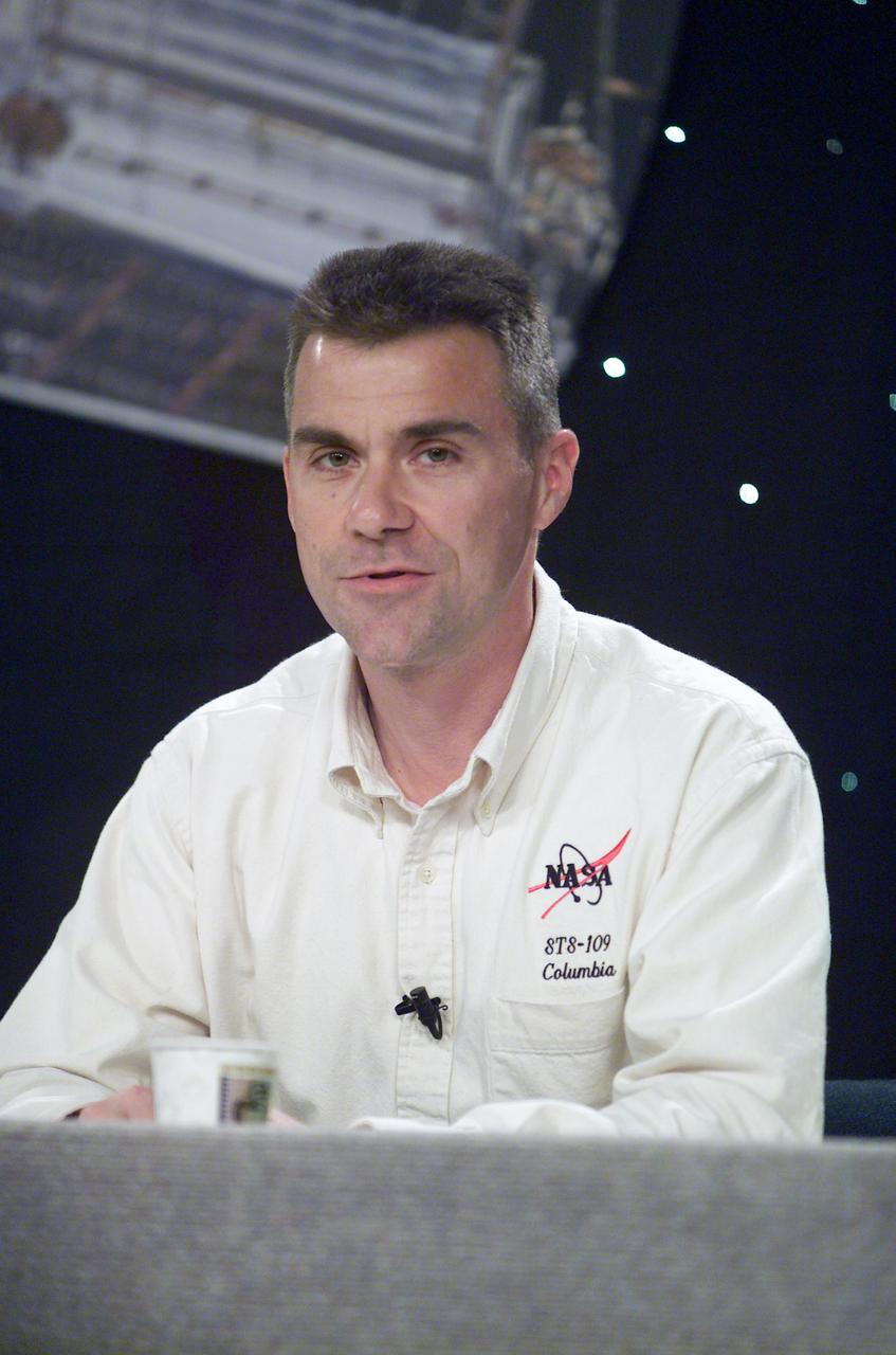 JSC2002-E-05098 (15 February 2002) --- Astronaut Duane G. Carey, STS-109 pilot, fields a question during a pre-flight press conference at Johnson Space Center (JSC).