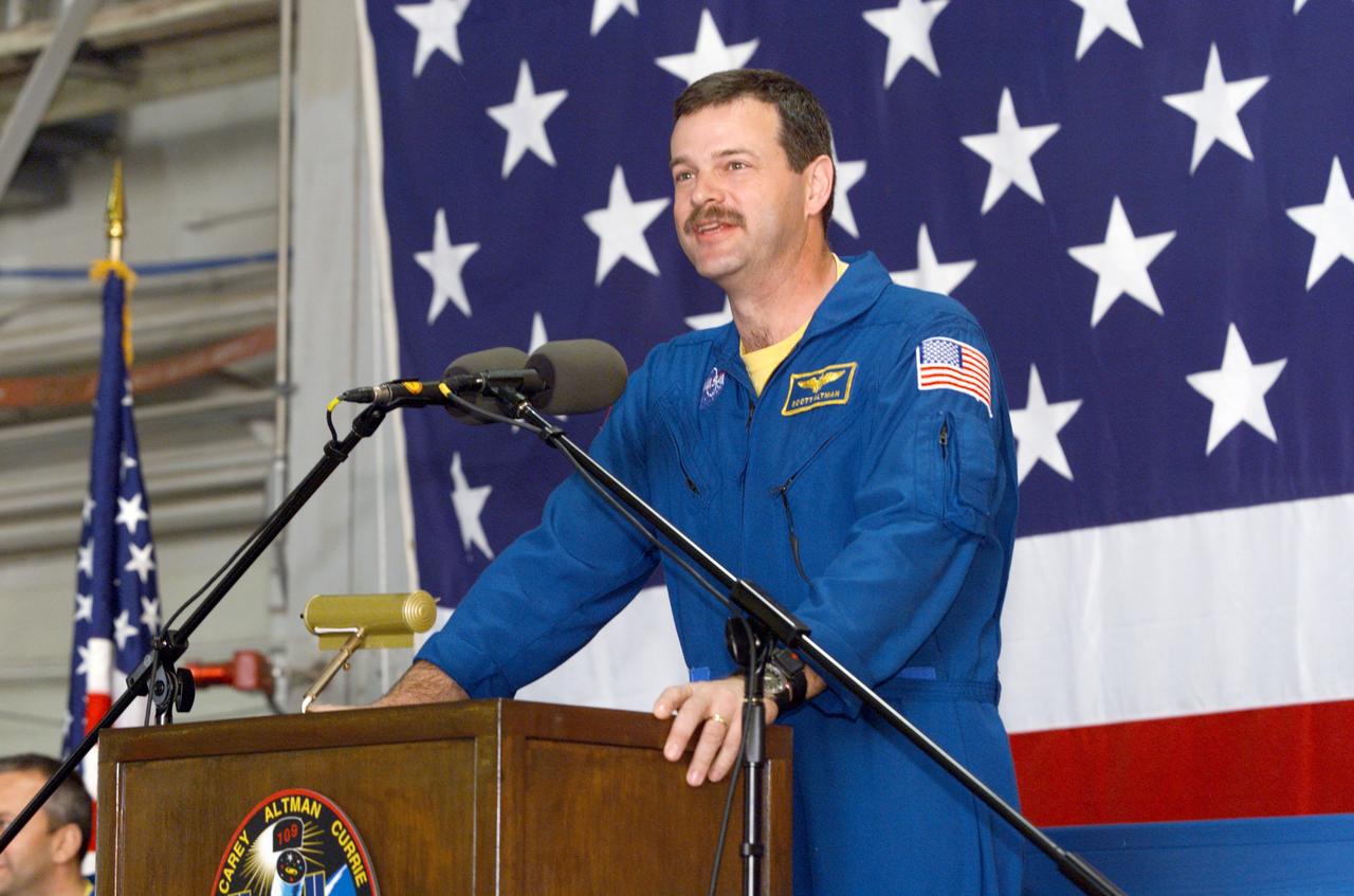 JSC2002-E-09337 (13 March 2002) --- Astronaut Scott D. Altman, STS-109 mission commander, speaks from the lectern in Hangar 990 at Ellington Field during the crew return ceremonies.