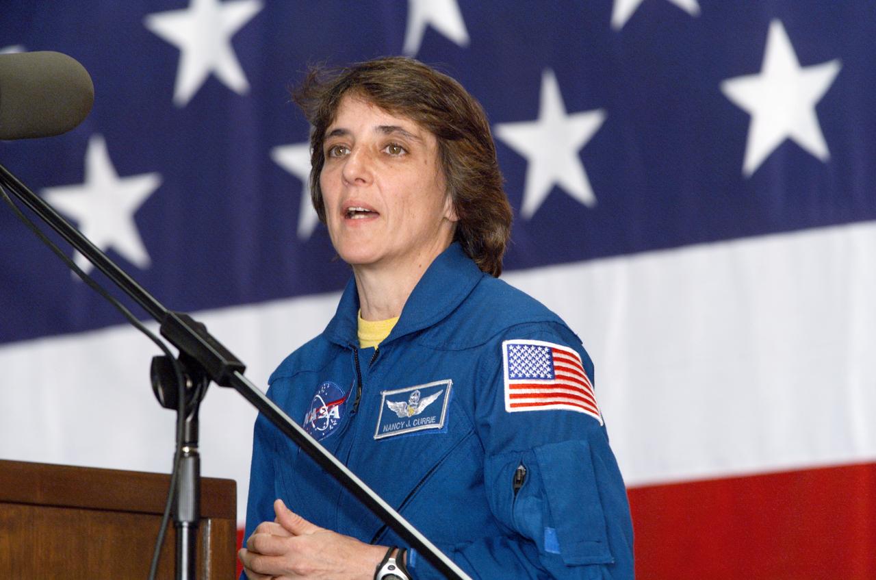 JSC2002-E-09340 (13 March 2002) --- Astronaut Nancy J. Currie, STS-109 mission specialist, speaks from the lectern in Hangar 990 at Ellington Field during the crew return ceremonies.