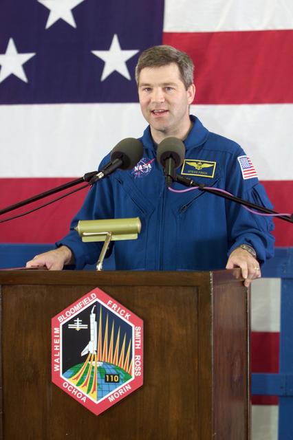 JSC2002-E-14071 (20 April 2002) --- Astronaut Stephen N. Frick, STS-110 pilot, speaks from the lectern in Hangar 990 at Ellington Field during the crew return ceremonies.