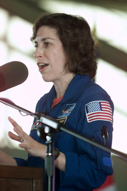JSC2002-E-14074 (20 April 2002) --- Astronaut Ellen Ochoa, STS-110 mission specialist, speaks from the lectern in Hangar 990 at Ellington Field during the crew return ceremonies. Photo credit: NASA