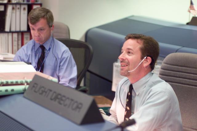 NASA image: Flight Director Richard E. LaBrode, Jr. and Astronaut Robert Thirsk work in Mission Control during STS-111
