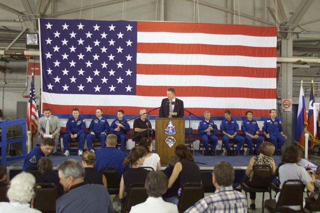 JSC2002-E-26021 (21 June 2002) --- Johnson Space Center&#0146;s (JSC) Director Jefferson Davis Howell, Jr. speaks from the lectern in Hangar 990 at Ellington Field during the STS-111 and Expedition Four crew return ceremonies. Seated (from left) are General Vasily Tsiblyiev, Deputy Director of the Gagarin Cosmonaut Training Center; cosmonaut Yury I. Onufrienko, Expedition Four mission commander; astronauts Carl E. Walz and Daniel W. Bursch, both Expedition Four flight engineers; NASA Administrator Sean O'Keefe; astronauts Kenneth D. Cockrell, STS-111 mission commander; Paul S. Lockhart, pilot; Franklin R. Chang-Diaz and Philippe Perrin, both mission specialists. Tsiblyiev and Onufrienko represent Rosaviakosmos, and Perrin represents CNES, the French Space Agency.