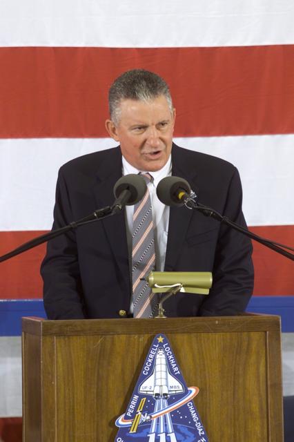 JSC2002-E-26022 (21 June 2002) --- Johnson Space Center&#0146;s (JSC) Director Jefferson Davis Howell, Jr. speaks from the lectern in Hangar 990 at Ellington Field during the STS-111 and Expedition Four crew return ceremonies.