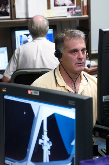 JSC2002-E-34622 (21 August 2002) --- Astronaut David A. Wolf, STS-112 mission specialist, uses the virtual reality lab at the Johnson Space Center (JSC) to train for his duties aboard the Space Shuttle Atlantis. This type of computer interface paired with virtual reality training hardware and software helps to prepare the entire team for dealing with ISS elements.