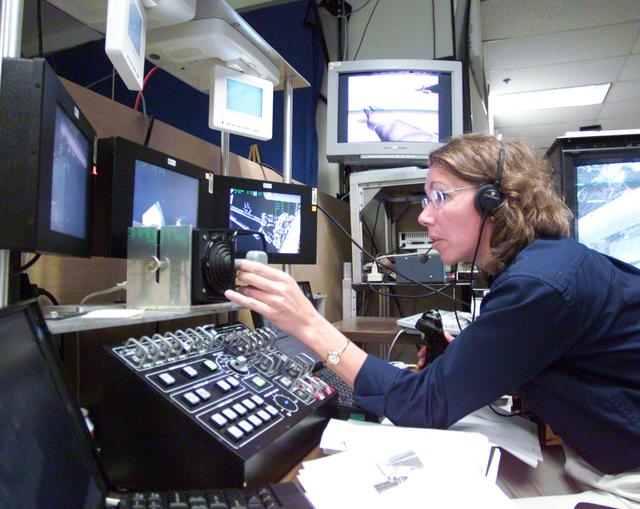 NASA image: Photographic coverage of STS-112 during EVA 3 in VR Lab.