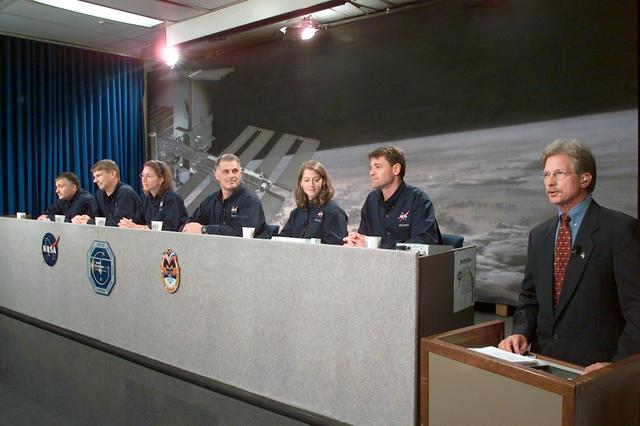 JSC2002-E-36208 (6 September 2002) --- The STS-112 crewmembers along with Public Affairs Office (PAO) moderator Doug Peterson (right) are photographed during a pre-flight press conference at Johnson Space Center (JSC). From the left are cosmonaut Fyodor N. Yurchikhin, astronauts Piers J. Sellers, Sandra H. Magnus, David A. Wolf, all mission specialists; Pamela A. Melroy and Jeffrey S. Ashby, pilot and mission commander, respectively. Yurchikhin represents Rosaviakosmos.