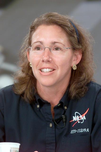 JSC2002-E-36214 (6 September 2002) --- Astronaut Sandra H. Magnus, STS-112 mission specialist, fields a question during a pre-flight press conference at Johnson Space Center (JSC).