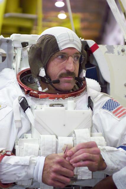 JSC2002-E-39735 (26 September 2002) --- Astronaut Daniel C. Burbank, STS-115 mission specialist, attired in a training version of the Extravehicular Mobility Unit (EMU) space suit, is about to begin a training session in the Neutral Buoyancy Laboratory (NBL) near the Johnson Space Center (JSC).