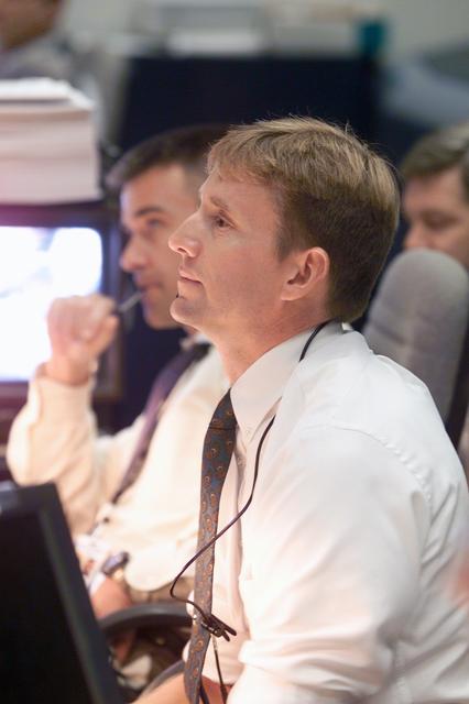 JSC2002-E-41160 (7 October 2002) --- Astronauts Kenneth T. Ham (foreground) and Duane G. Carey, spacecraft communicators (CAPCOM), watch the large screens from their consoles in the shuttle flight control room (WFCR) in Houston&#0146;s Mission Control Center (MCC). At the time this photo was taken the Space Shuttle Atlantis was about to launch from the Kennedy Space Center, Florida. Atlantis lifted off at 2:46 p.m. (CDT) on October 7, 2002. Once the vehicle cleared the tower in Florida, the Houston-based team of flight controllers took over the ground control of the flight.
