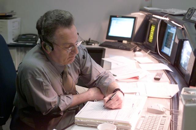 JSC2002-E-41241 (9 October 2002) --- Rob Navias, Public Affairs Office (PAO) commentator, is pictured at his console in the shuttle flight control room (WFCR) in Houston’s Mission Control Center (MCC) during the STS-112 mission.