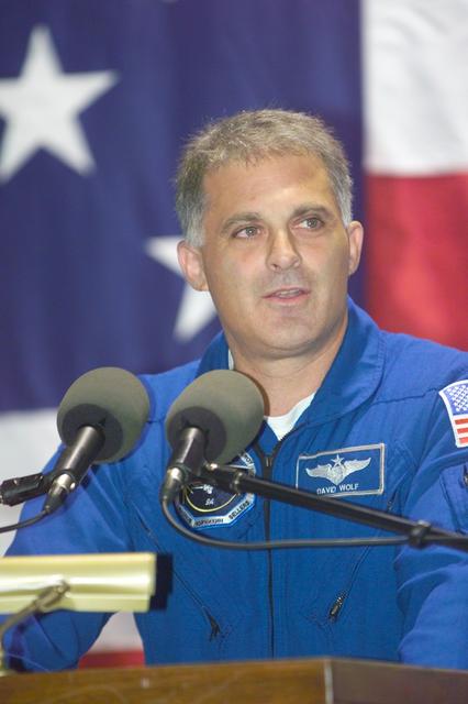 JSC2002-E-42182 (19 October 2002) ---  Astronaut David A. Wolf, STS-112 mission specialist, addresses an Ellington Field crowd following the return to Houston by the STS-112 mission's six crewmembers.