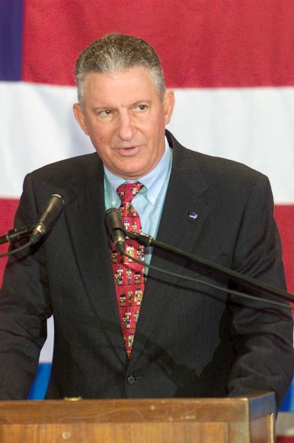 JSC2002-E-48247 (9 December 2002) --- General Jefferson D. Howell, Jr., JSC Director, faces a crowd on hand at Ellington Field's Hangar 990 as he introduces the members of the STS-113 and Expedition Five crews, who landed a day earlier in Florida aboard the Space Shuttle Endeavour.