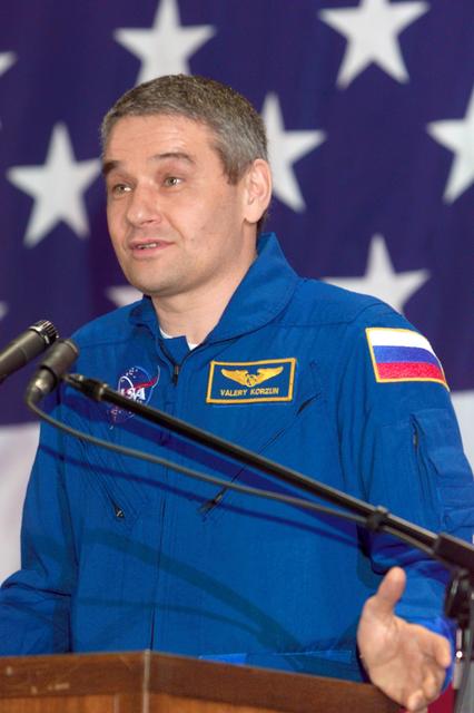 JSC2002-E-48258 (9 December 2002) --- Cosmonaut Valery G. Korzun, Expedition Five commander, addresses a crowd on hand at Ellington Field's Hangar 990. The STS-113 and Expedition Five crews had landed a day earlier aboard the Space Shuttle Endeavour in Florida. For Korzun and his two station crewmates, it had been approximately six months since they had been on terra firma.