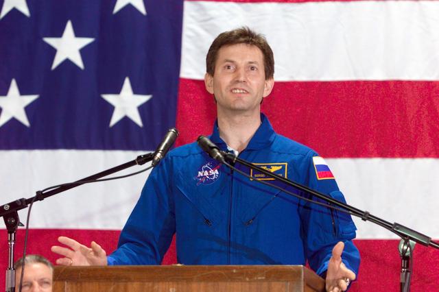 JSC2002-E-48262 (9 December 2002) --- Cosmonaut Sergei Y. Treschev of Rosaviakosmos, who just completed approximately six months of service as Expedition Five flight engineer, addresses a welcoming crowd on hand at Ellington Field's Hangar 990. The STS-113 and Expedition Five crews had landed a day earlier aboard the Space Shuttle Endeavour in Florida.