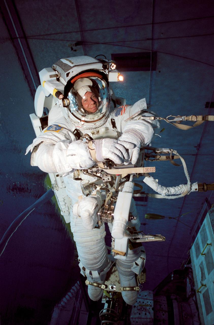 JSC2003-00014 (7 January 2003) --- Astronaut Christer Fuglesang, STS-116 mission specialist, wearing a training version of the Extravehicular Mobility Unit (EMU) spacesuit, participates in an underwater simulation of extravehicular activity (EVA) scheduled for the 19th shuttle mission to the International Space Station (ISS). Fuglesang was joined by astronaut Robert L. Curbeam, Jr. (out of frame), mission specialist, for the simulation, conducted in the Neutral Buoyancy Laboratory (NBL) near the Johnson Space Center. Fuglesang represents the European Space Agency (ESA).