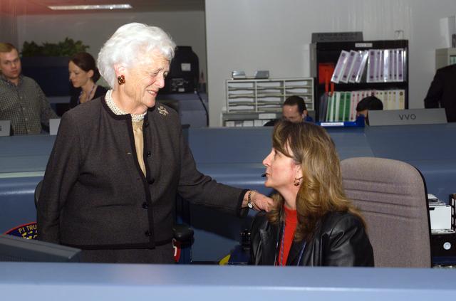 NASA image: Former President George H. W. Bush and Mrs. Bush visit with Mission Control Center personnel.