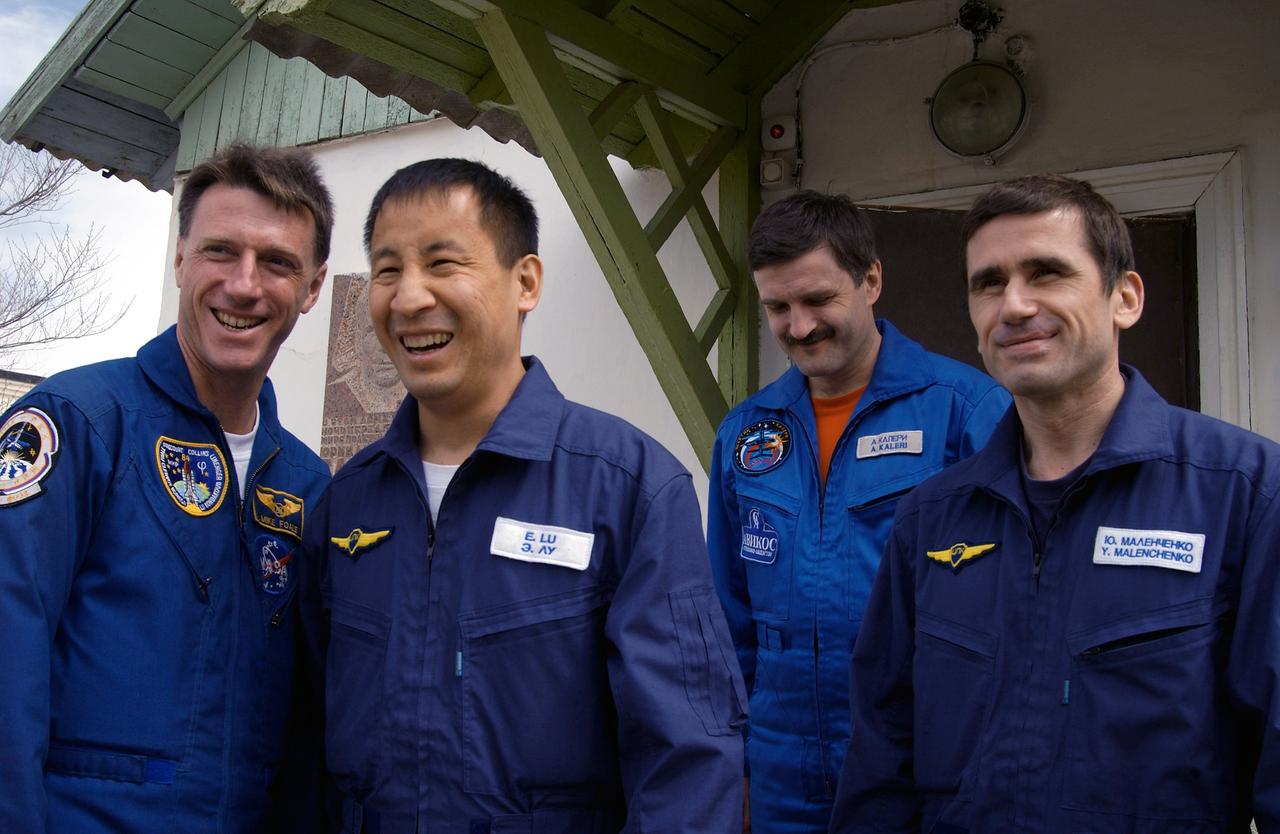 JSC2003-E-31957 (22 April 2003) --- Astronauts C. Michael Foale (left), Expedition Seven backup crewmember; Edward T. Lu, NASA ISS science officer and flight engineer; cosmonauts Alexander Y. Kaleri, backup crewmember; and Yuri I. Malenchenko, mission commander; are pictured as they visit the quarters of Yuri Gagarin after having visited the Soyuz launch pad and performing a final check of the Soyuz capsule at the Baikonur Cosmodrome, Kazakhstan. Malenchenko and Kaleri represent Rosaviakosmos. Photo credit: NASA/Scott Andrews.