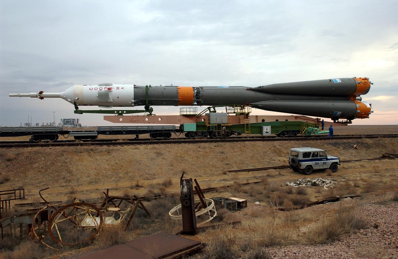 JSC2003-E-31959 (24 April 2003) --- A Soyuz rocket is rolled out of the assembly building and travels via rail to the launch pad at the Baikonur Cosmodrome, Kazakhstan. Expedition Seven is scheduled to launch onboard the Soyuz on Saturday April 26, 2003. Photo credit: NASA/Scott Andrews.
